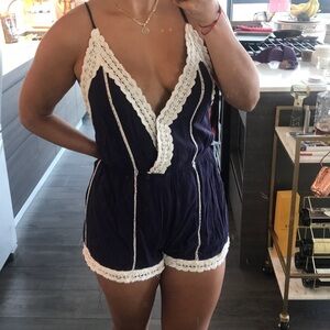 Navy & cream lace deep v open back romper small